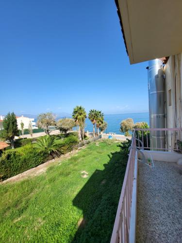 a balcony with a view of the ocean at Panorama Hotel - Restaurant in Diakopto