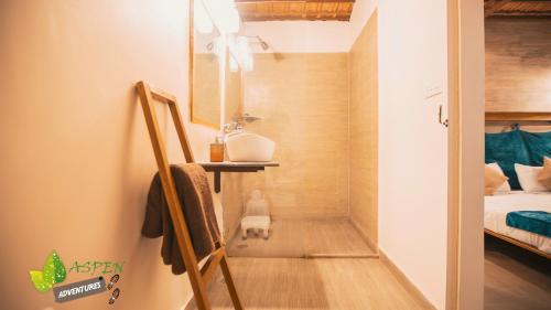 a bathroom with a walk in shower in a bedroom at Aspen Adventures Camp by Aspen in Rishīkesh