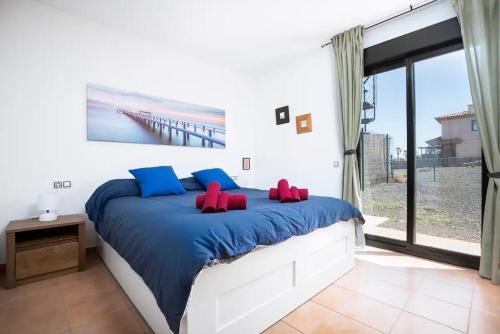 Postel nebo postele na pokoji v ubytování Villardilla Fuerteventura