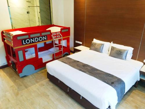 a room with two beds and a lego bus at Southern Airport Hotel Hatyai in Hat Yai
