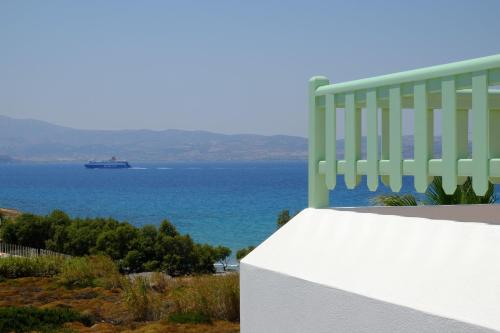 a cruise ship in the ocean with a building at Valea Villa in Agios Prokopios