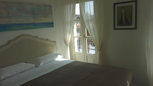 Un ou plusieurs lits dans un hébergement de l'établissement La Corte di Vicolo Torre