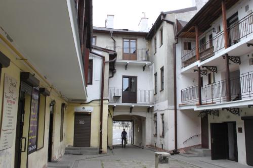 a man walks through an alley in a building at Lublin Apartaments in Lublin