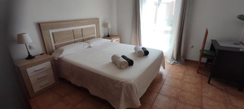 Katil atau katil-katil dalam bilik di Alojamiento Parque Corralejo