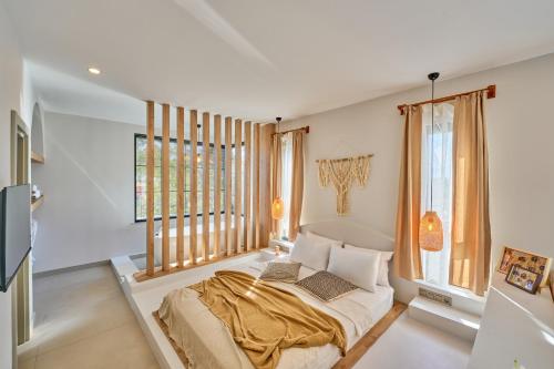 a bedroom with a bed and a large window at Lilium Boutique Hotel in Antalya
