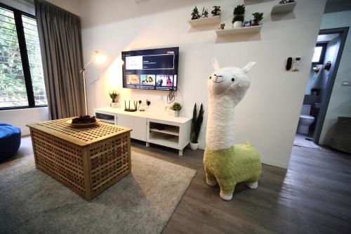 a living room with a statue of a llama at Genting View Resort GVR Kempas in Genting Highlands