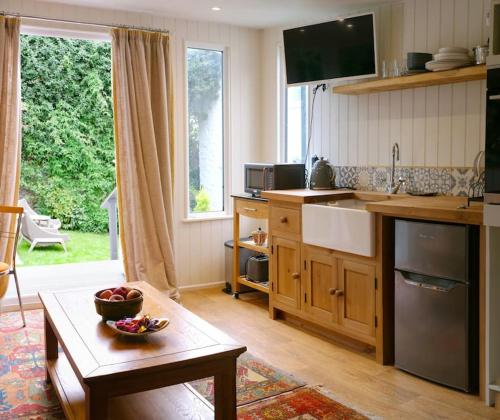 a kitchen with a sink and a counter top at The Garden Room in Knighton