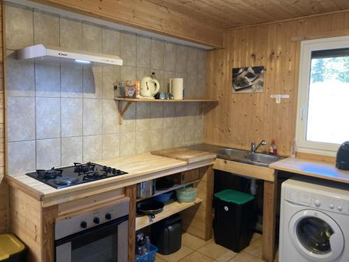 a small kitchen with a stove and a sink at Chalet Le Monêtier-les-Bains, 3 pièces, 6 personnes - FR-1-762-25 in Le Monêtier-les-Bains