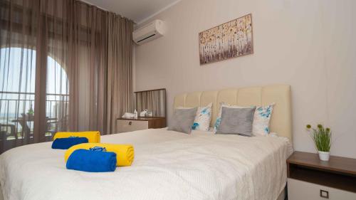 En eller flere senge i et værelse på Burgas Residence 610