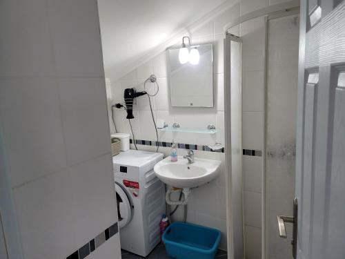 a small bathroom with a sink and a mirror at Dalaman Botanik Garden in Dalaman