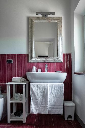 a bathroom with a white sink and a mirror at Villa delle Torri - Teloni in San Gimignano