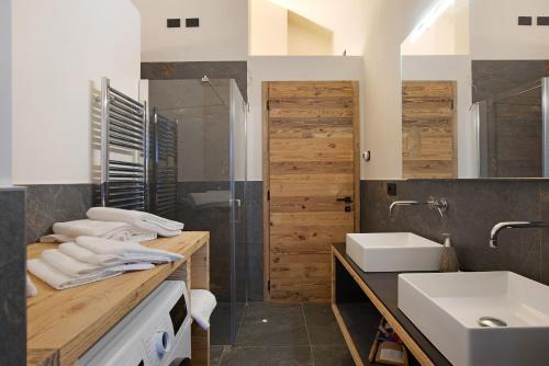 a bathroom with a sink and a toilet and a shower at Valgrisa Mountain Lodges 1 in Valgrisenche