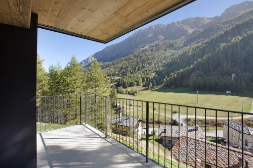 a balcony with a view of a mountain at Valgrisa Mountain Lodges 1 in Valgrisenche