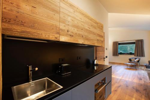 a kitchen with a sink and a counter top at Valgrisa Mountain Lodges 1 in Valgrisenche