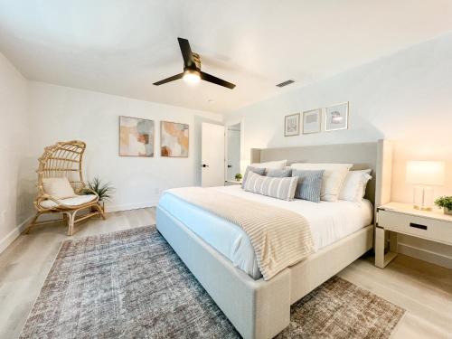 a bedroom with a bed and a ceiling fan at Waterfront Home with Pool Minutes to Sanibel in Fort Myers