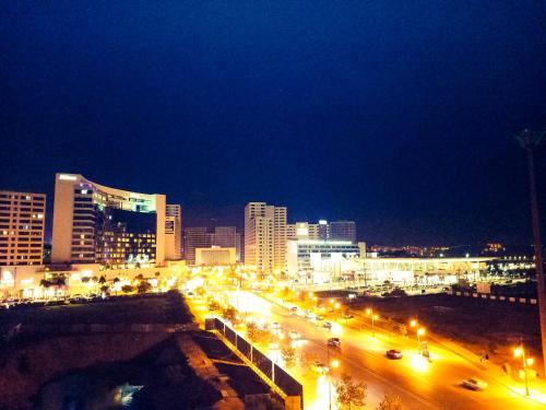 a city lit up at night with street lights at Moderne Appartement au plein Centre-Ville en Face Hilton in Tangier