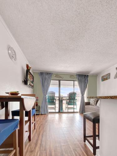 a living room with a view of the ocean at Galveston beach front and ocean views at Casa Del Mar in Galveston