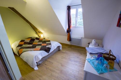 a small bedroom with a bed and a window at Chambres d'hôtes du Coq à l'Ane in Beaubec-la-Rosière
