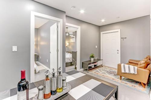 a living room with a table with wine bottles at Modern Rental - Pet-Friendly, Free Parking in Hollywood
