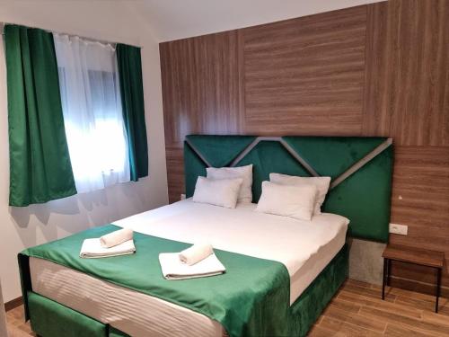Postel nebo postele na pokoji v ubytování Luxury Rooms C Kragujevac