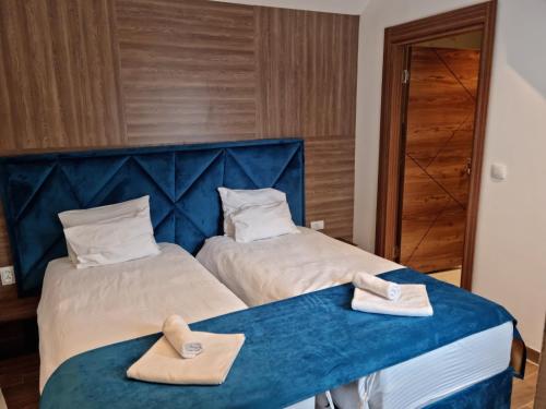 Postel nebo postele na pokoji v ubytování Luxury Rooms C Kragujevac