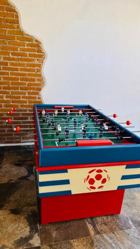 a pool table sitting in front of a brick wall at Finca Los Angeles Hospederia & Sociales in Huasca de Ocampo