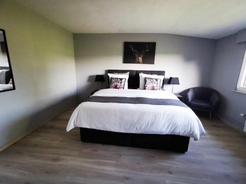 Una cama o camas en una habitación de Lanonweye