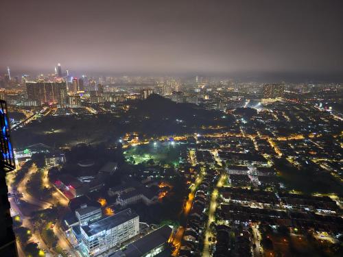 an aerial view of a city at night at Arte Cheras The Premium Suites by iLuxHome in Kuala Lumpur