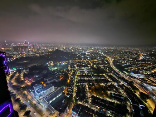 an aerial view of a city at night at Arte Cheras The Premium Suites by iLuxHome in Kuala Lumpur