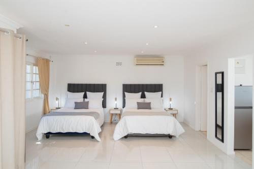 En eller flere senge i et værelse på Queen Julie Constantia Upper Cottage