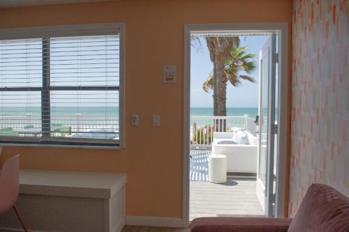 a living room with a view of the ocean at Sunburst Inn- Indian Shores Beach in Clearwater Beach