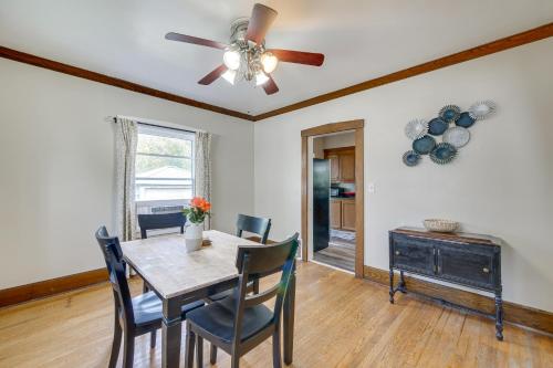 a dining room with a table and a ceiling fan at Welcoming Home in Youngstown with Private Backyard! in Youngstown
