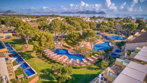 an aerial view of a resort with two pools at Zafiro Mallorca & Spa in Can Picafort