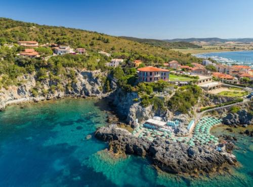an aerial view of a resort on a rocky coast at Tuscan Gallery House in Grosseto