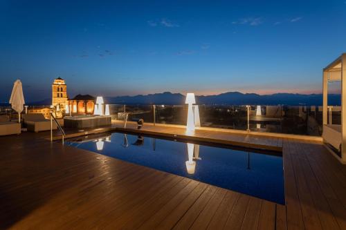 a swimming pool on the roof of a building at Can Ribera by Zafiro in Muro