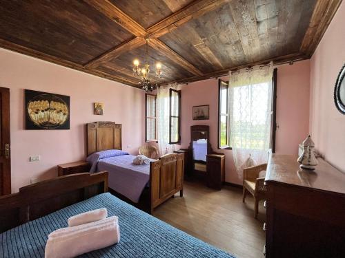 Postel nebo postele na pokoji v ubytování Ca' De Franceschi