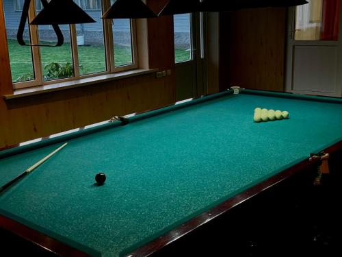 a pool table with balls on top of it at Sunny Valley Karakol in Karakol