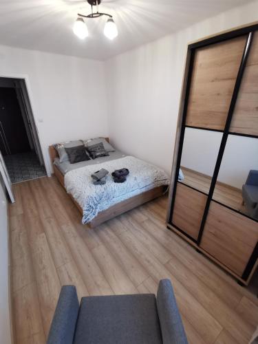 Katil atau katil-katil dalam bilik di Apartament Łukasińskiego