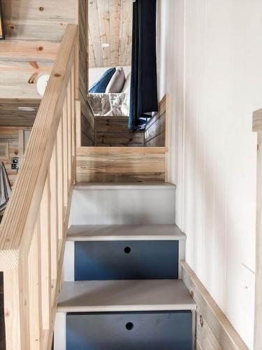 a stairwell in a tiny house with wooden walls at The Little Park in Farmington