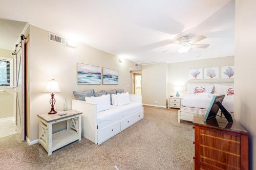 a bedroom with two beds and a ceiling fan at High Hammock 171 in Seabrook Island