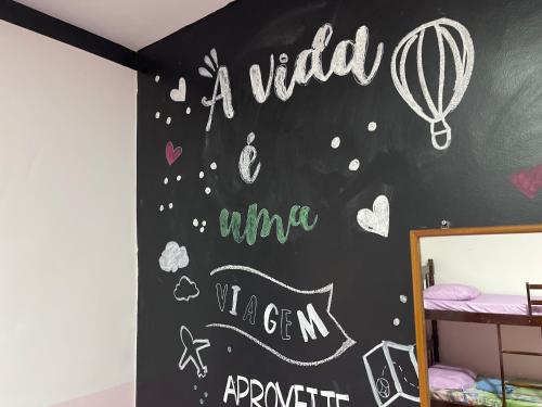 Postel nebo postele na pokoji v ubytování Toca da Mona Roots Hostel