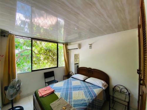 Katil atau katil-katil dalam bilik di Casa Feliz Hostal