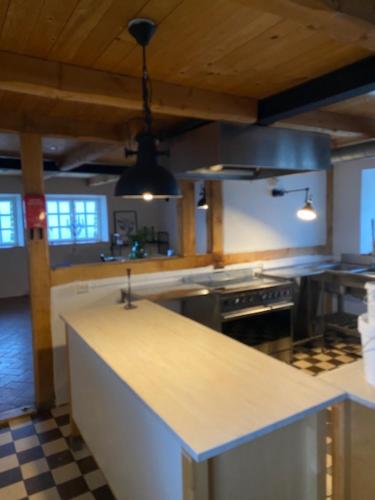 a large kitchen with a counter top in a room at 10 min från Malmö/Lund in Staffanstorp