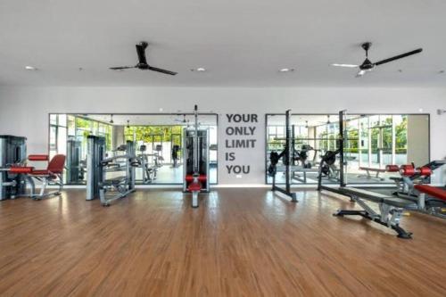 a gym with treadmills and machines in a room at KLIA Homestay Apartment - 2 room in Sepang