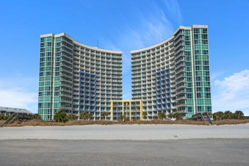 two tall buildings with a beach in front of them at Avista Resort 1503 in Myrtle Beach