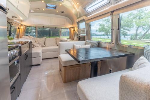 a kitchen and living room of an rv at AustinTeton's Sunset Cliff Resort on Lake Travis - PRIVATE WEDDING, EVENT, HEATED POOL, BOAT DOCK in Austin