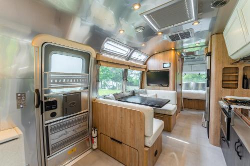 an interior view of an rv kitchen and living room at AustinTeton's Sunset Cliff Resort on Lake Travis - PRIVATE WEDDING, EVENT, HEATED POOL, BOAT DOCK in Austin