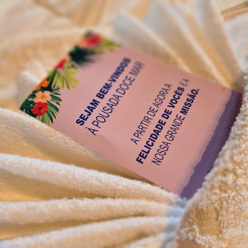 a bar of toothpaste sitting on top of a towel at Pousada Doce Mar in Guarda do Embaú