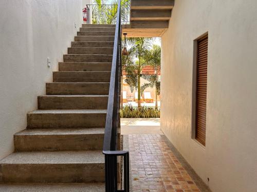 a set of stairs leading up to a house at Hotelito Zicatela in Brisas de Zicatela