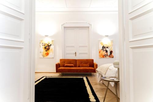 a living room with a couch and a table at The Gallery in Munich